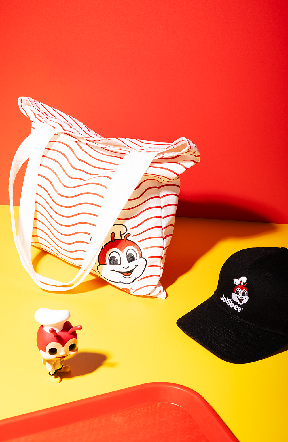 Jollibee wavy tote bag with black hat and Jollibee toy