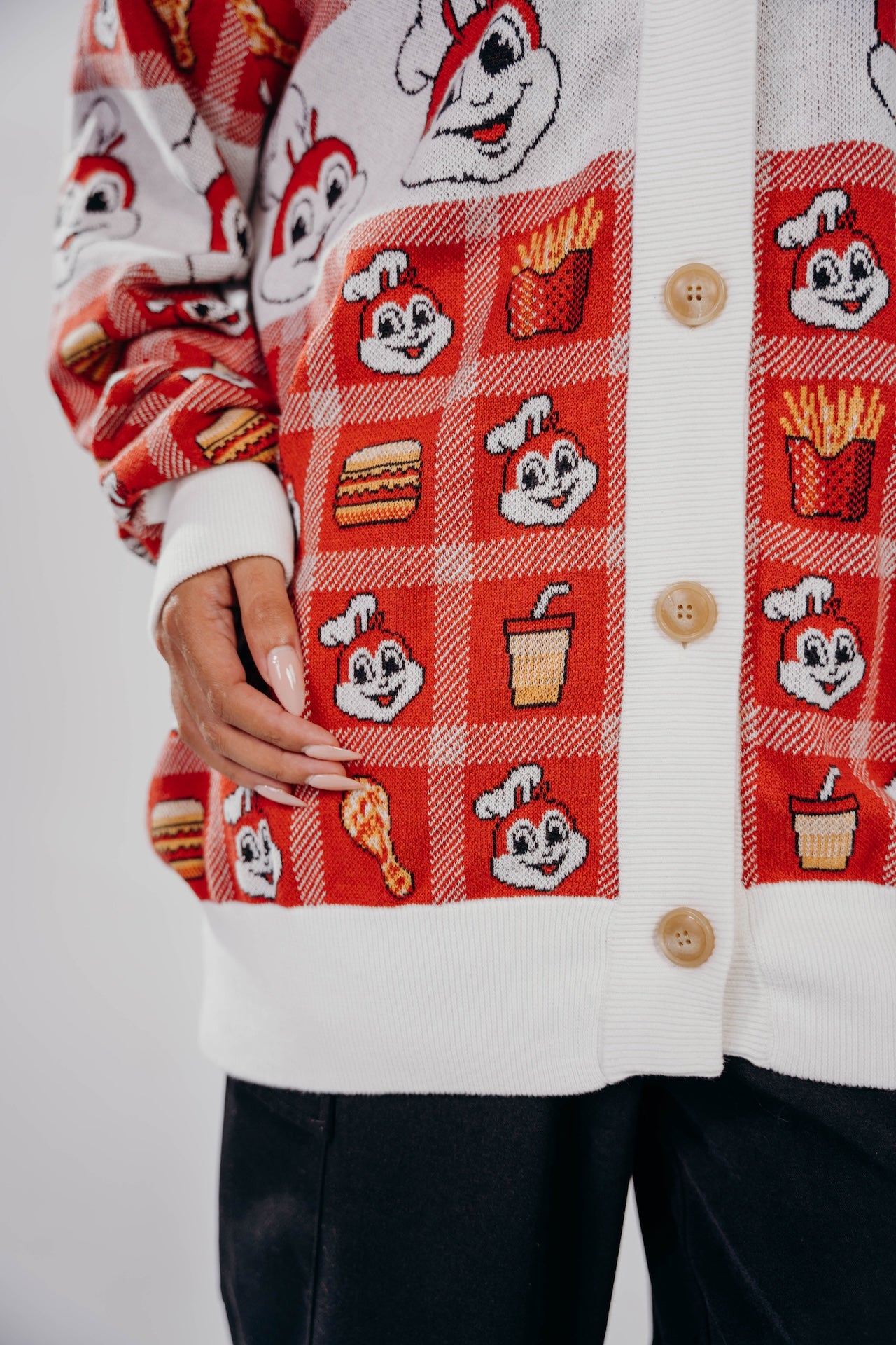 Cardigan with Jollibee and food pattern on a white background