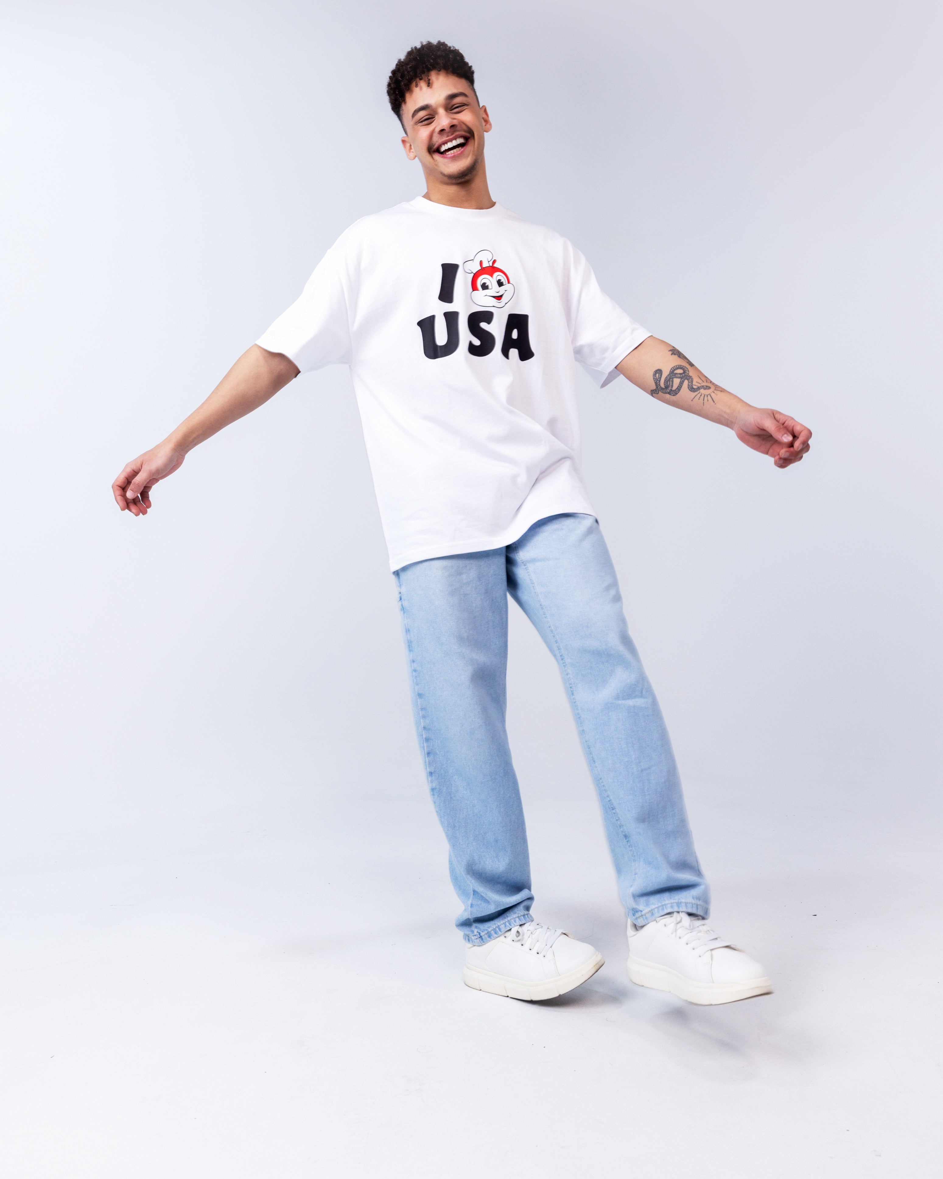 laughing guy wearing the I JB USA white shirt