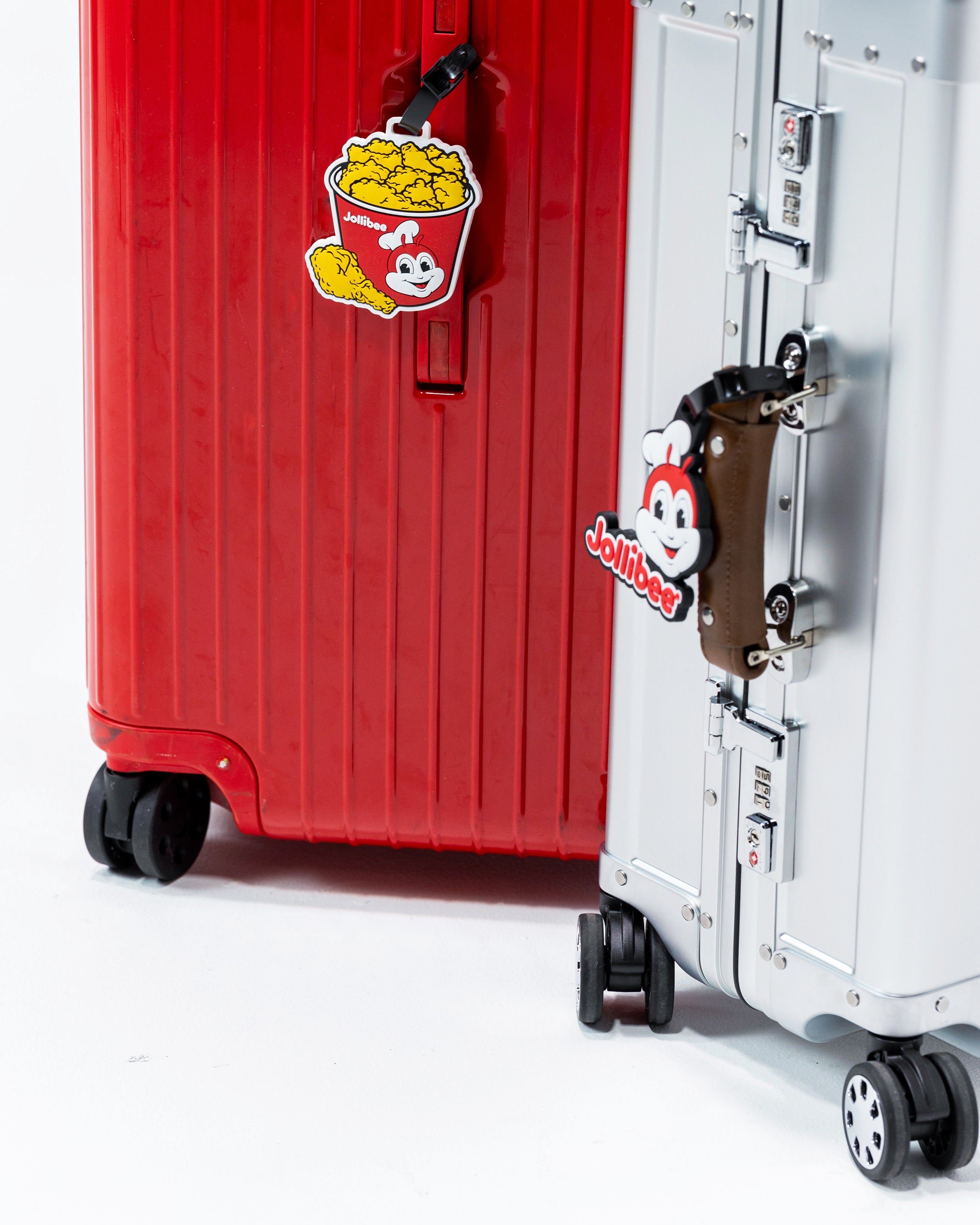 Jollibee bucket luggage tag and Jollibee logo luggage tag on luggages.
