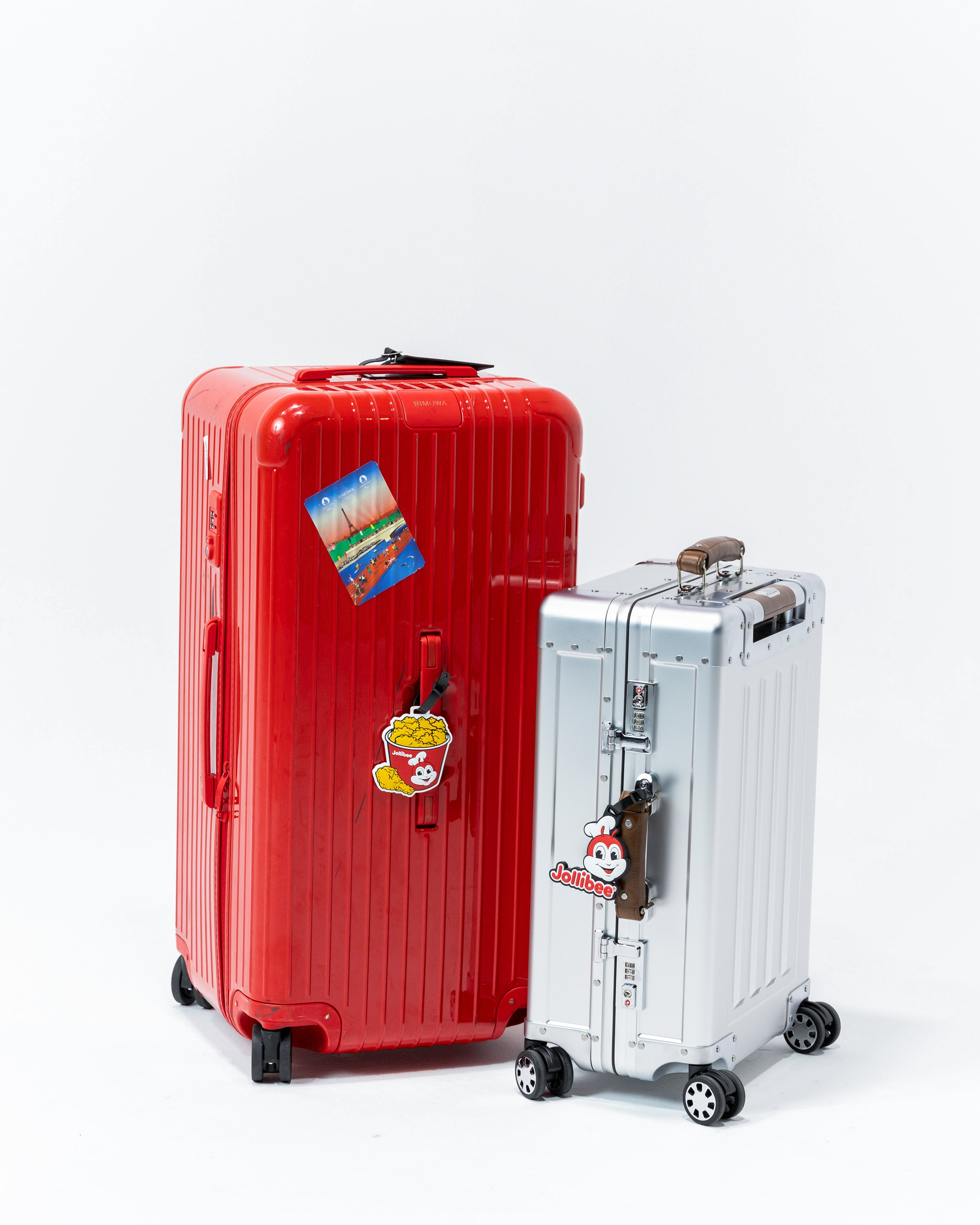 Jollibee bucket luggage tag and Jollibee logo luggage tag on luggages.