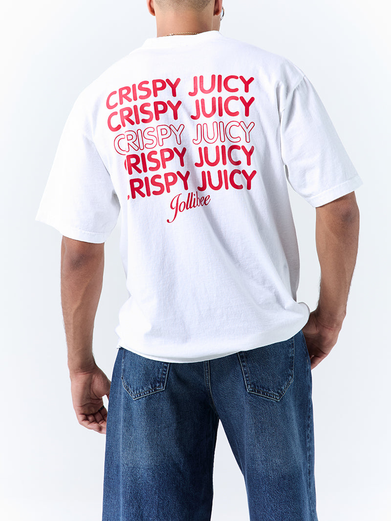 A young man wearing a white t-shirt with a 'CRISPY JUICY JOLLIBEE' text in red font color on a white background.