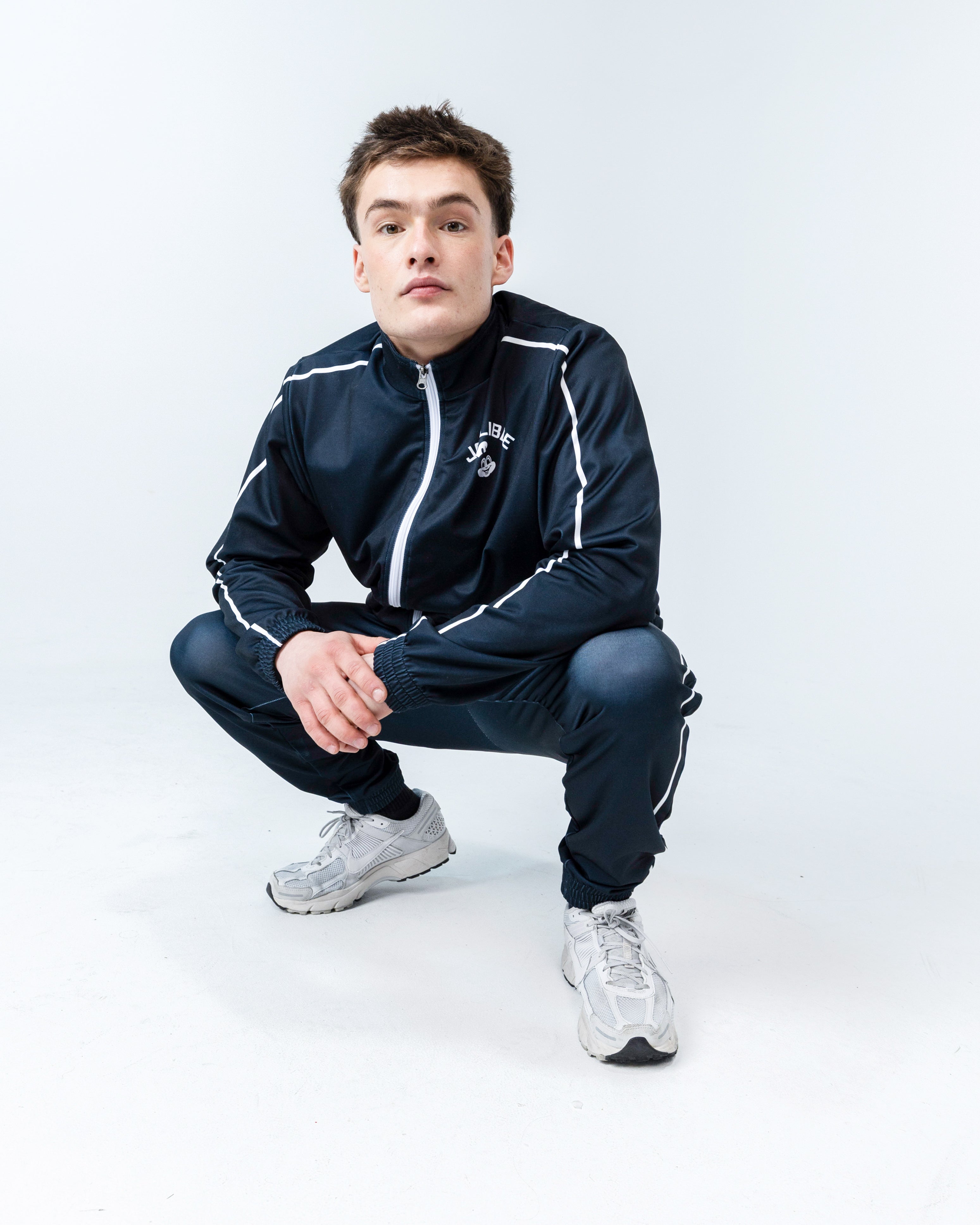 guy wearing Jollibee merch black tracksuit