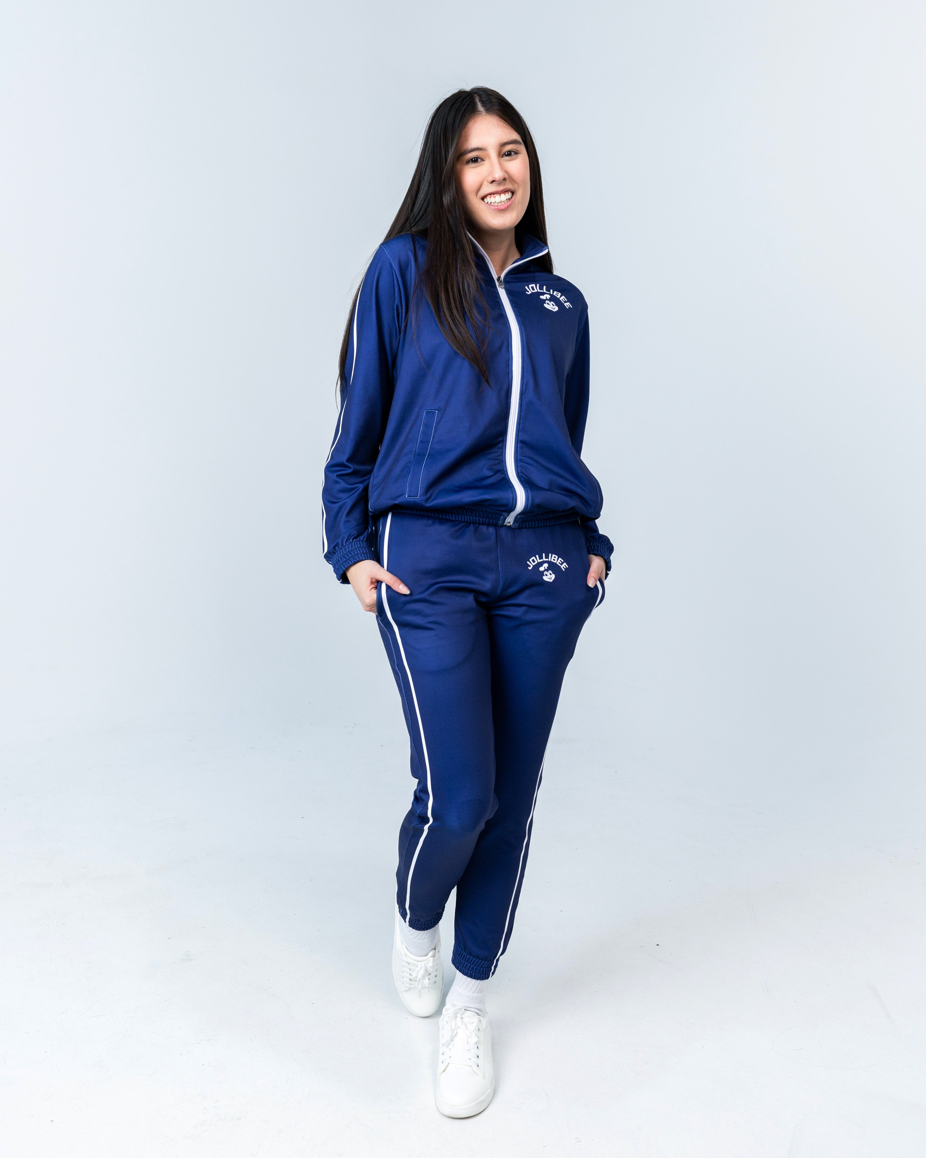 young woman wearing the Jollibee merch blue tracksuit