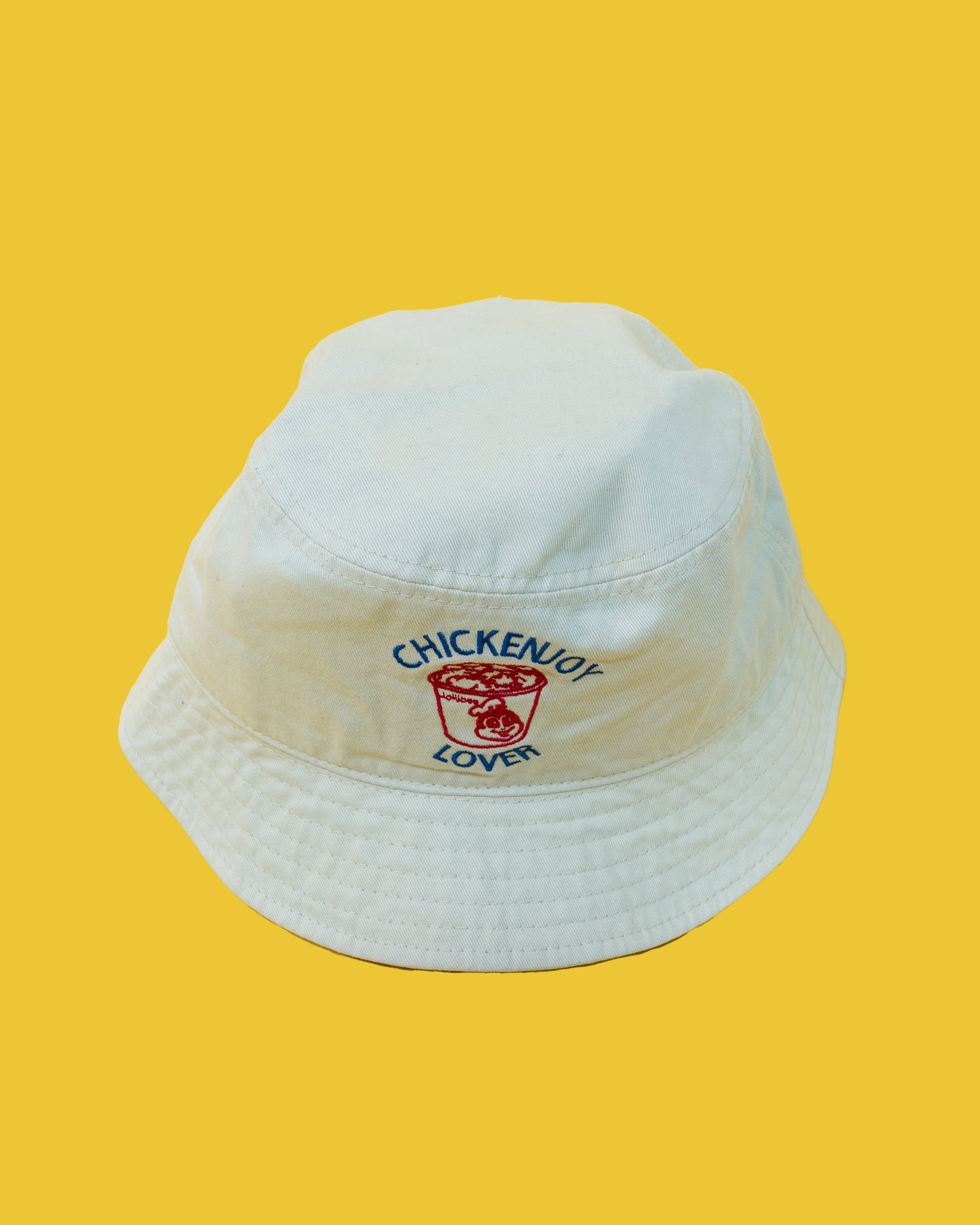 White bucket hat with 'Chickenjoy Lover' text on a yellow background