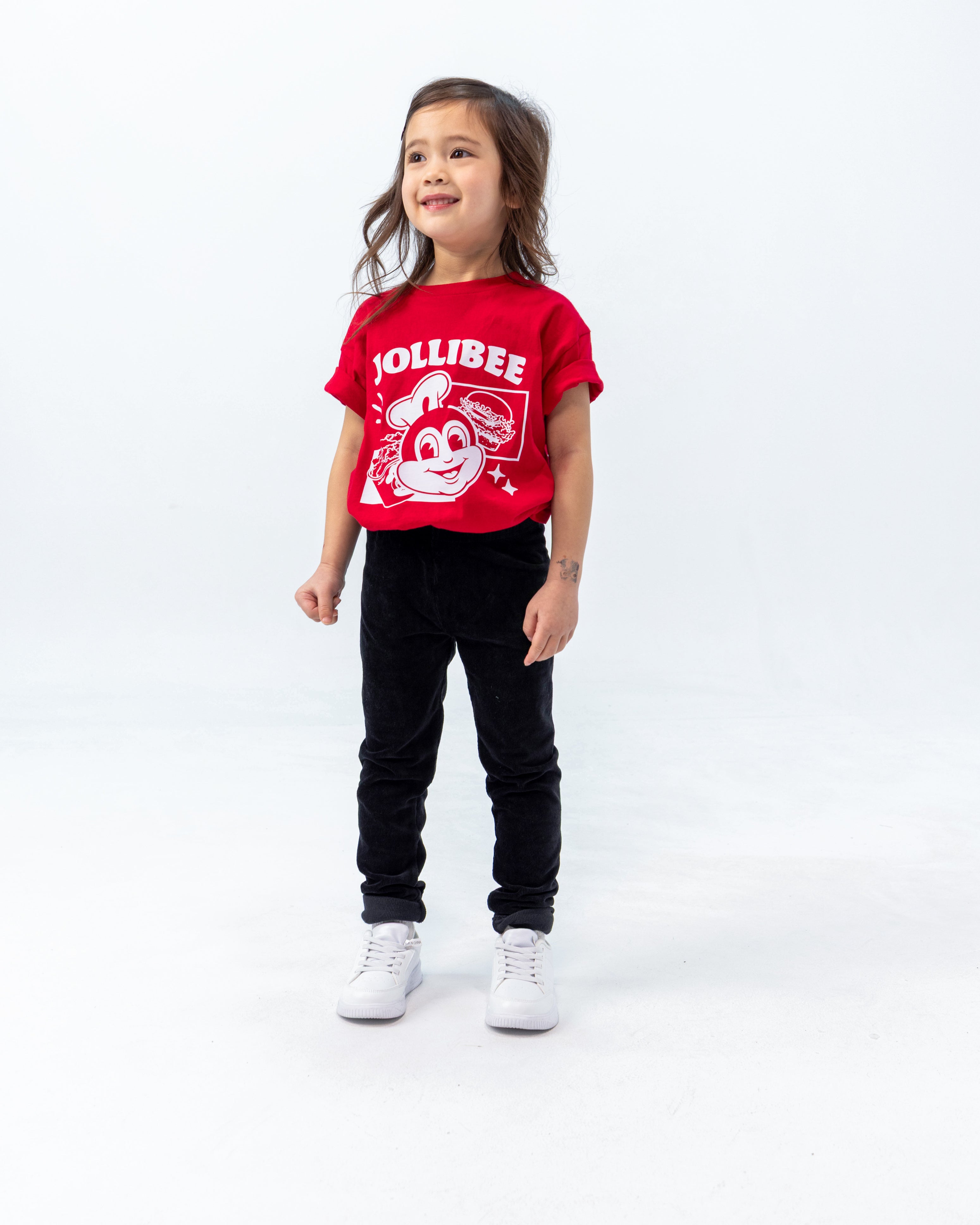 smiling little girl wearing the Jollibee merch kid retro red shirt