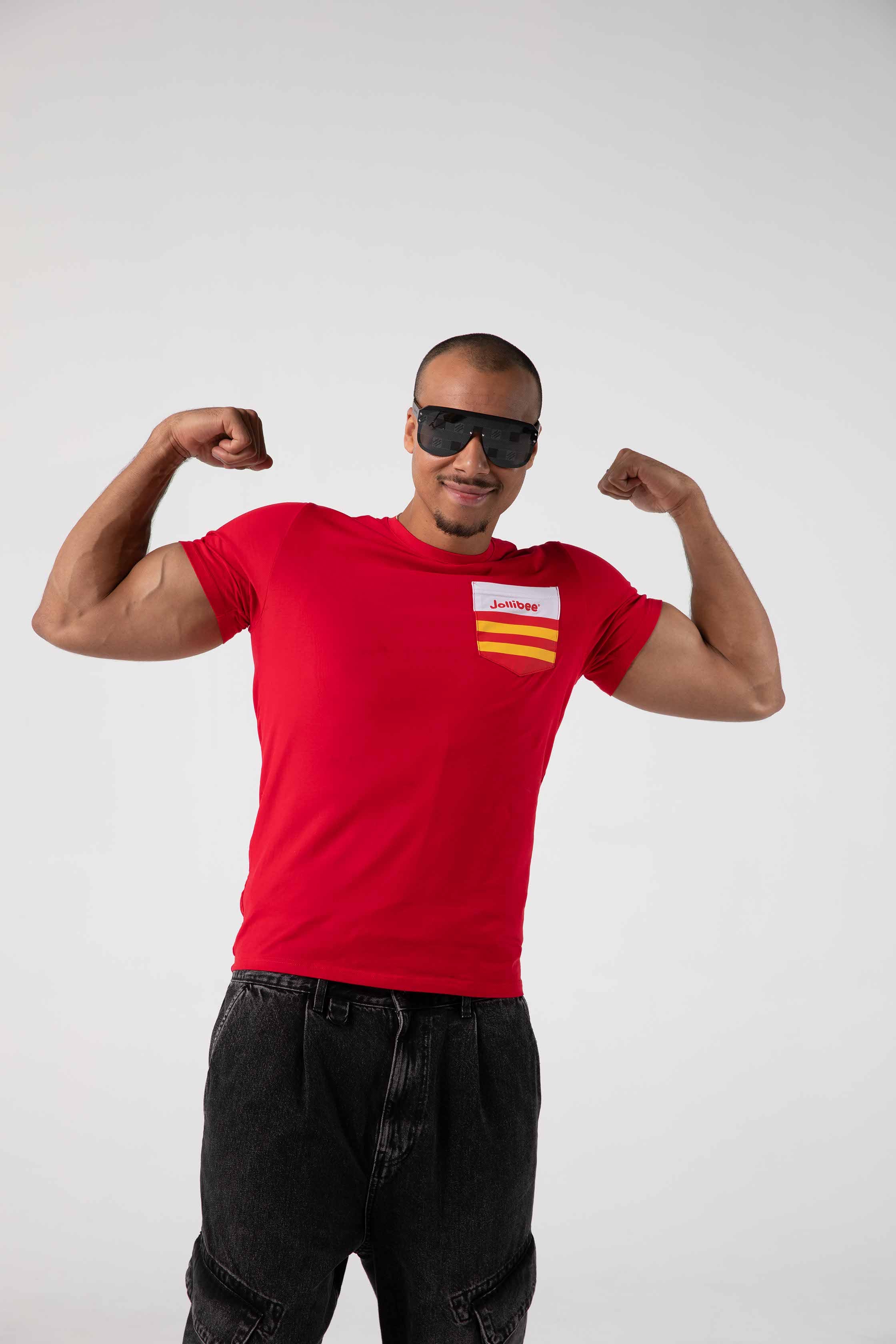 Person wearing a red t-shirt with a Jollibee logo, flexing muscles on a white background