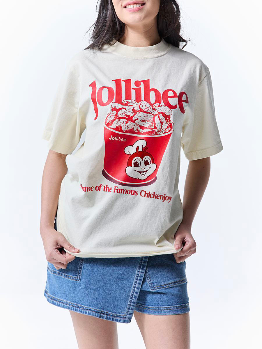 Person wearing a Jollibee t-shirt with a logo on a white background