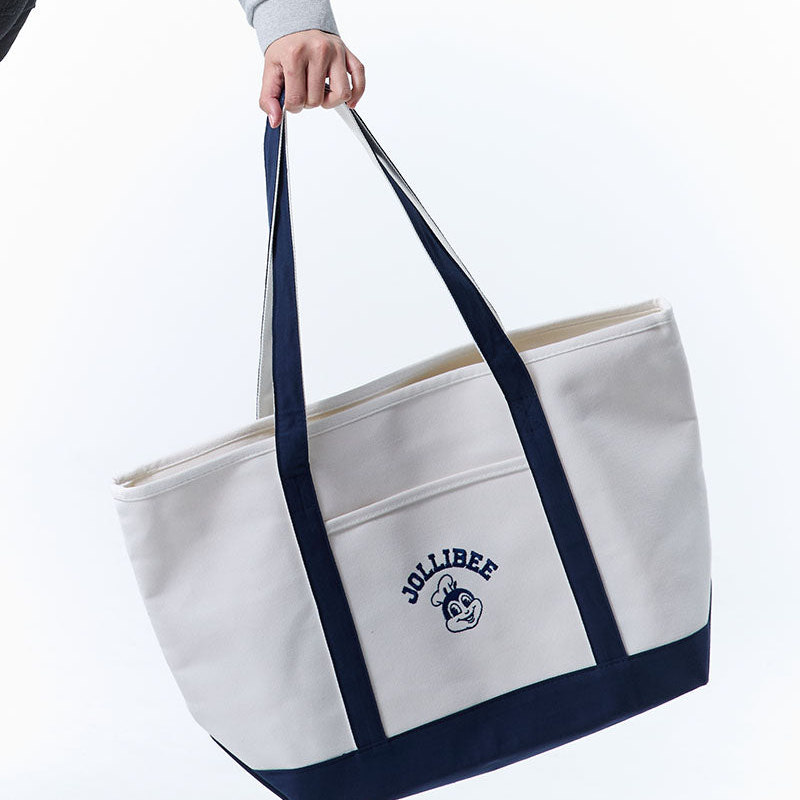 White tote bag with navy handles and Jollibee logo on a white background