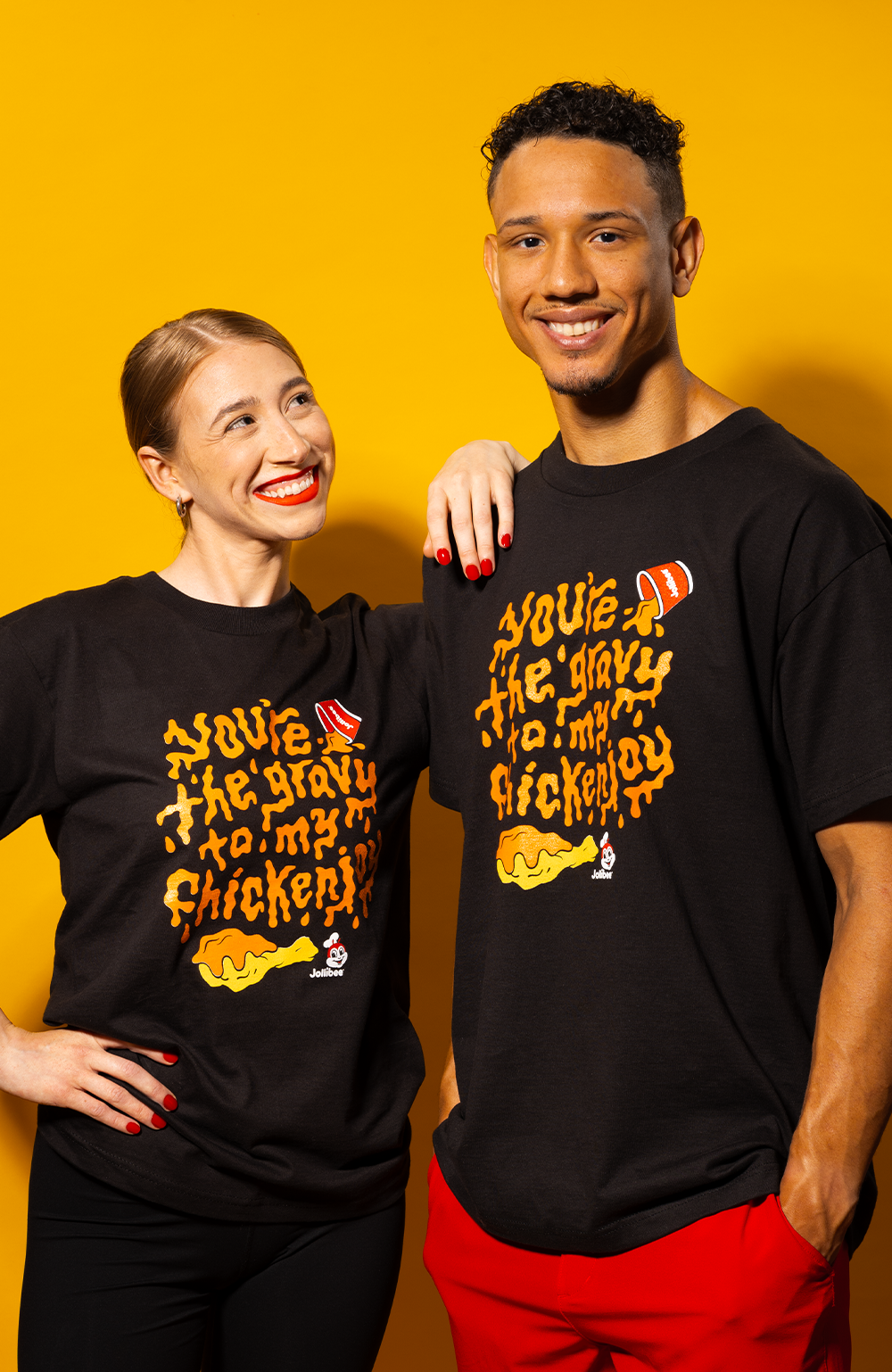 a couple wearing the Jollibee Black Gravy T-Shirt