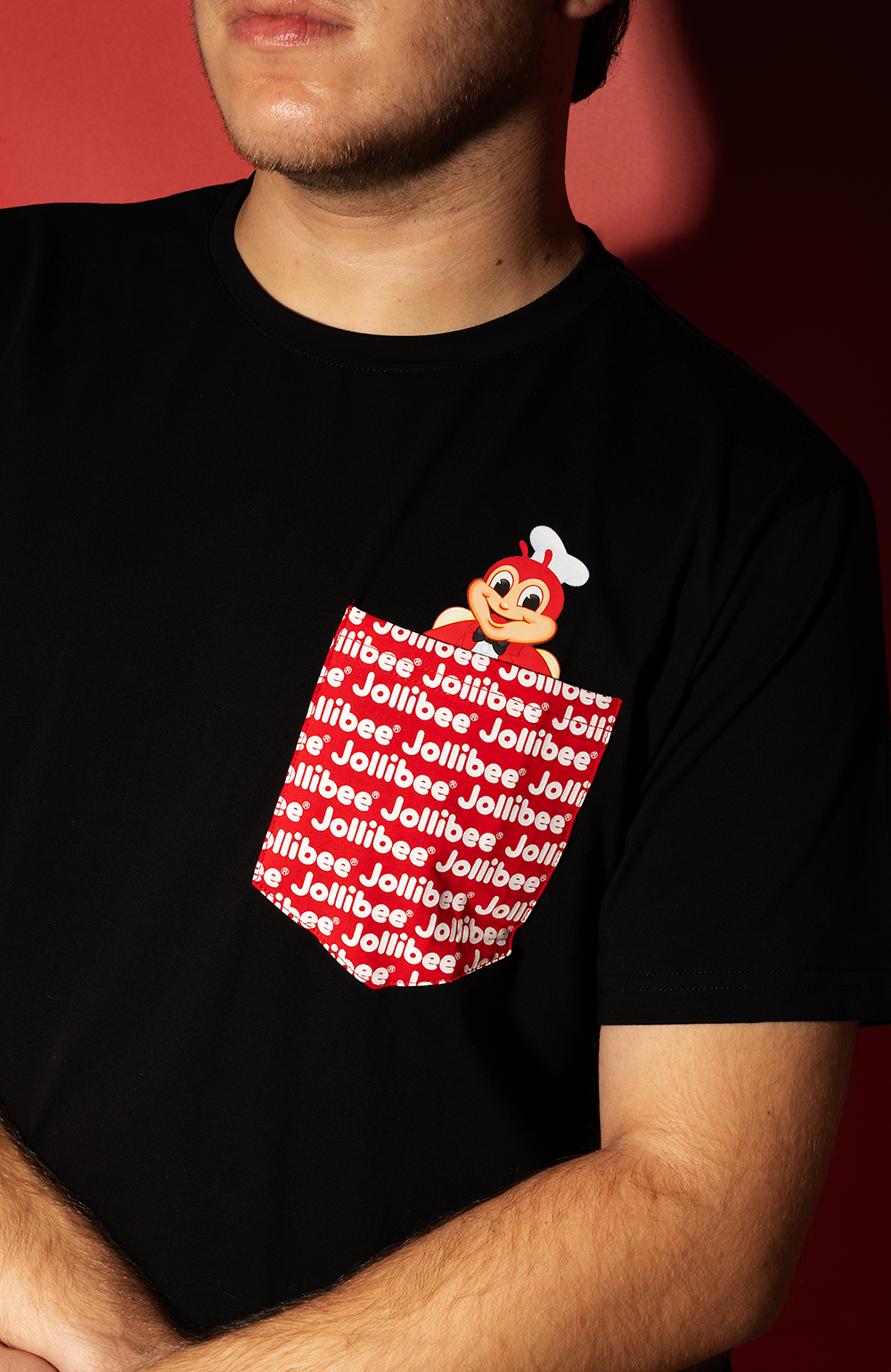 guy wearing the Jollibee black pocket tee