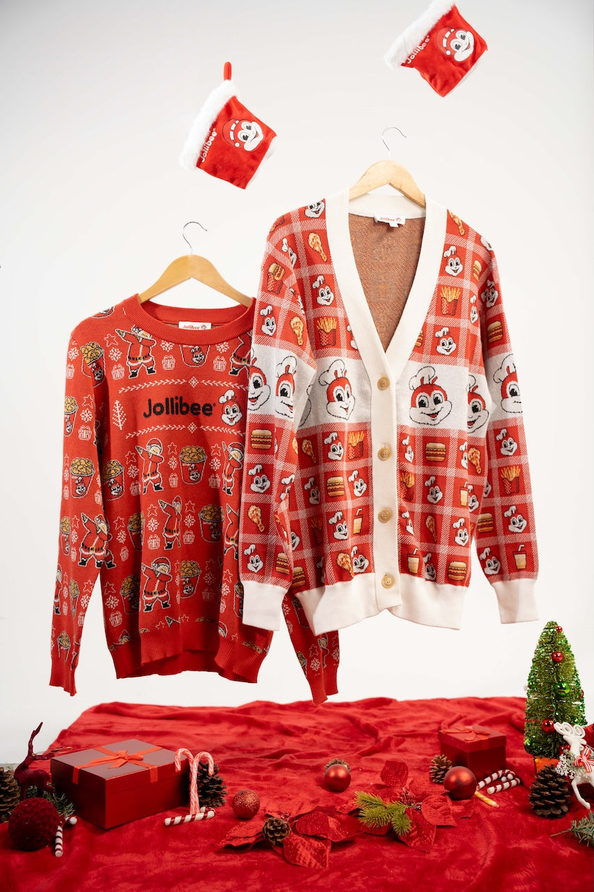 Red and white Jollibee cardigan, matching red sweater, and festive decorations on a white background.