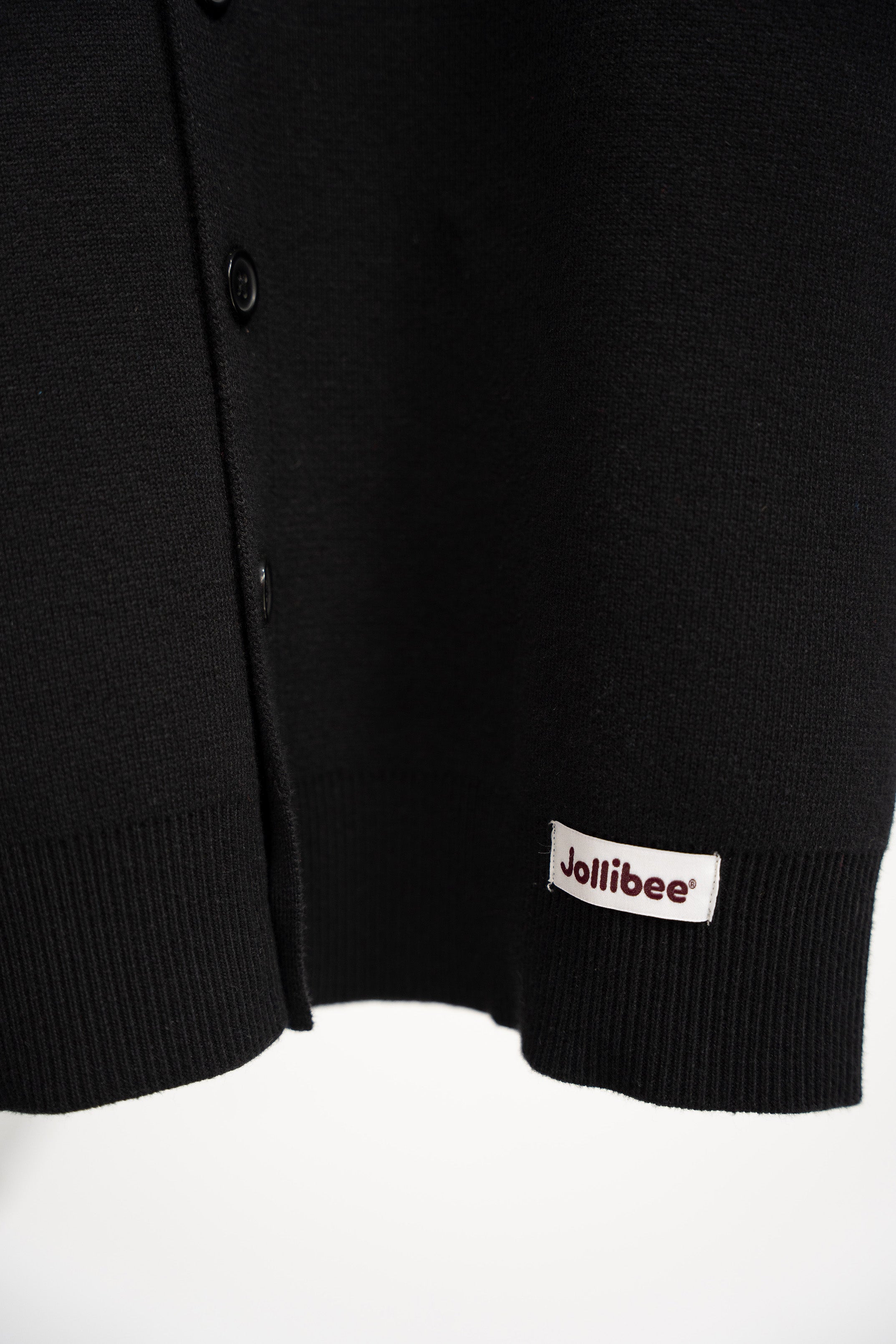 Black cardigan with a Jollibee logo on a white background
