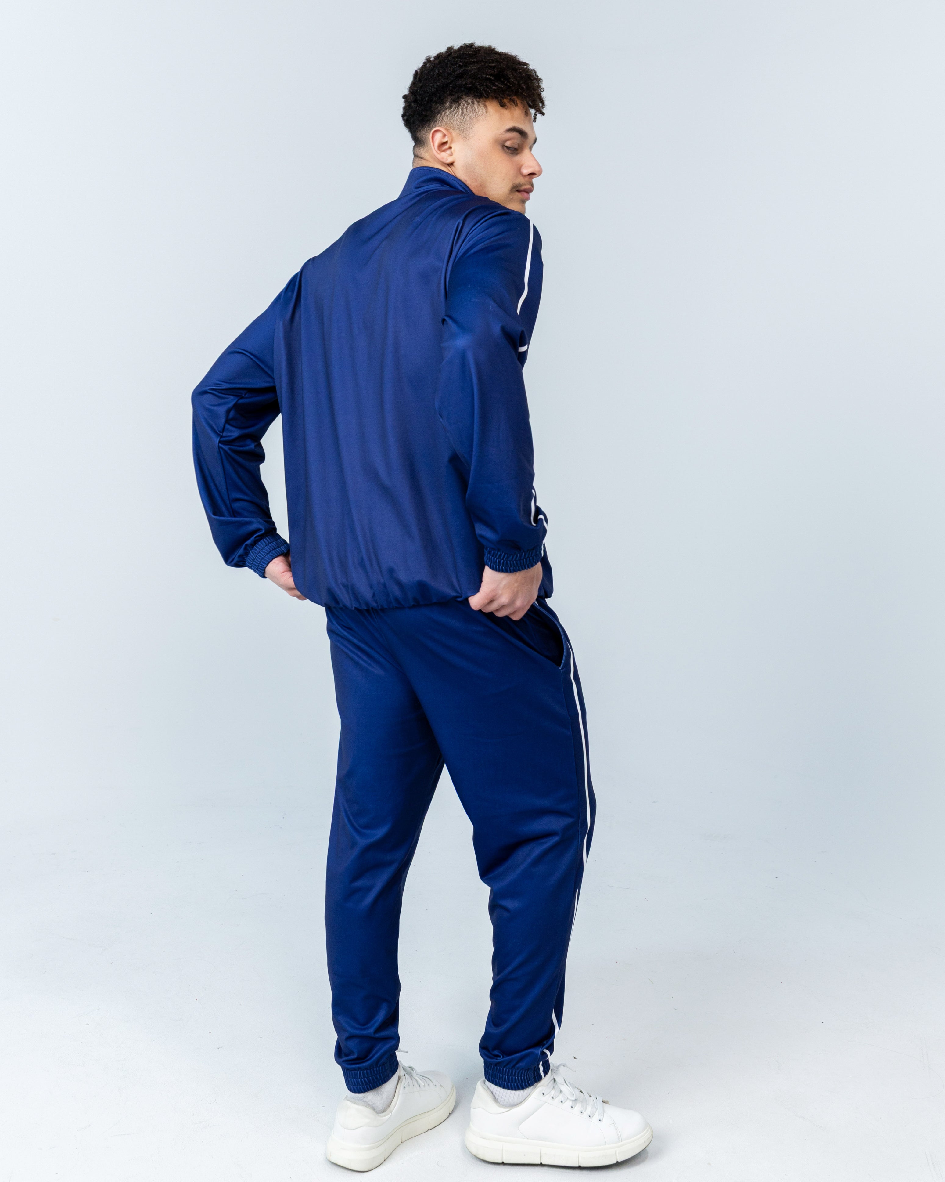 young man wearing the Jollibee merch blue tracksuit