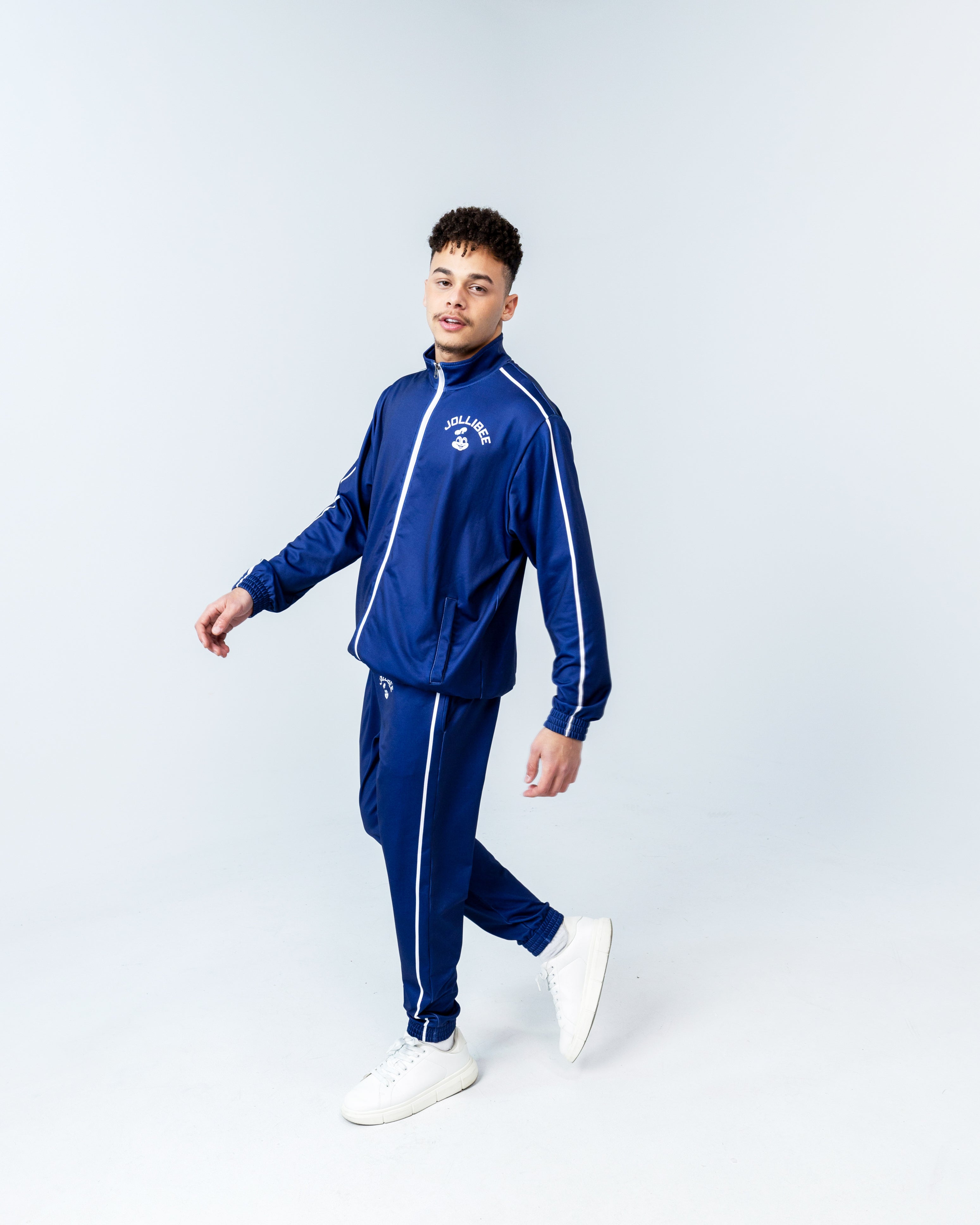 young man wearing the Jollibee blue tracksuit