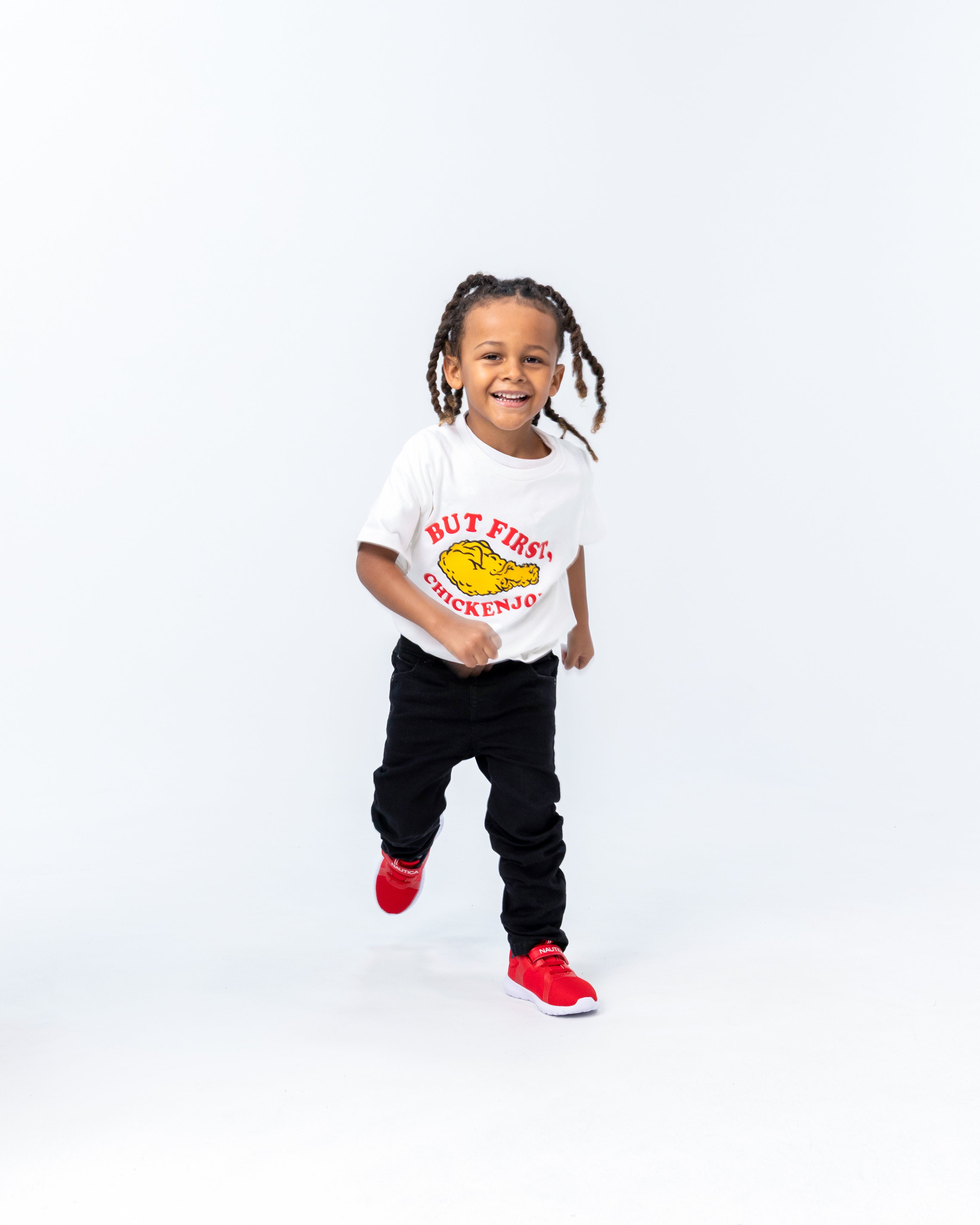 cute little boy running and wearing Jollibee merch But First Chickenjoy kid t-shirt