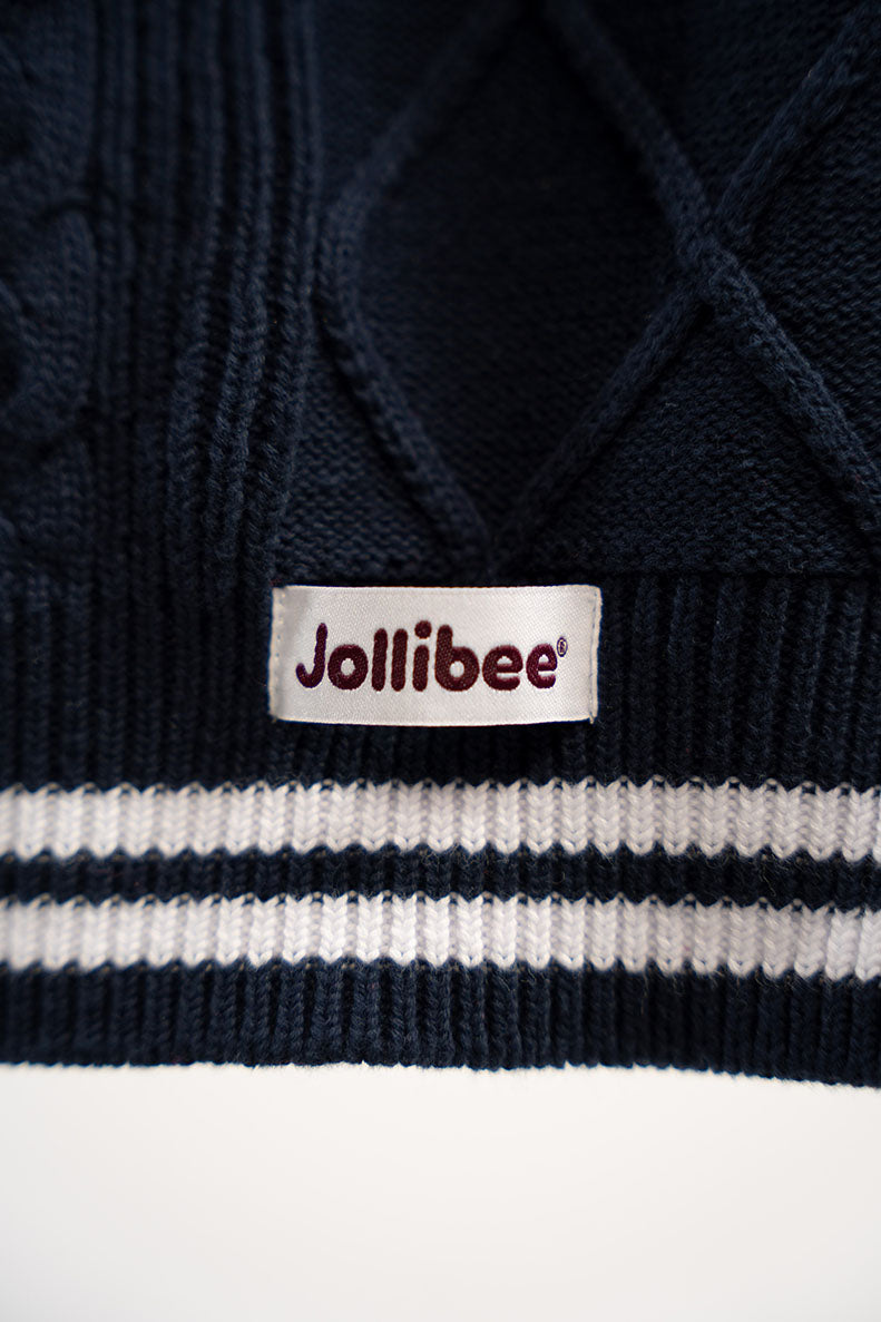 Navy blue sweater with a Jollibee label on a white background