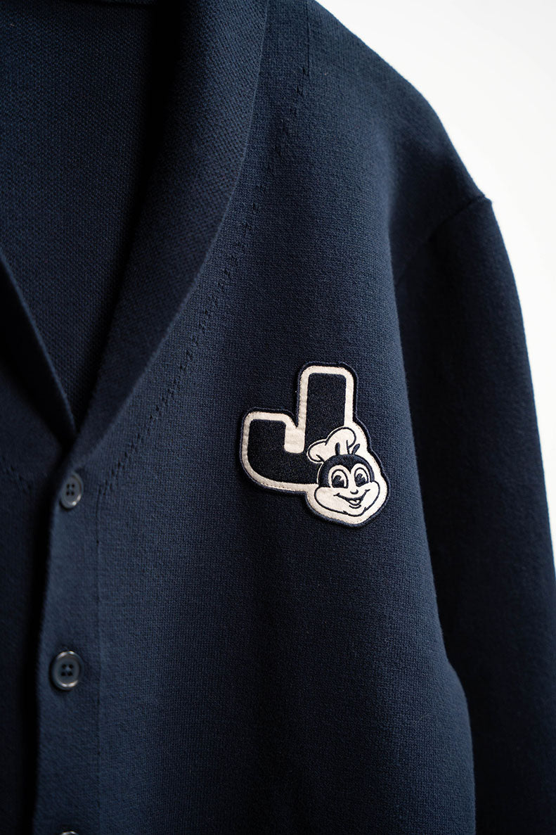 Navy blue cardigan with a Jollibee logo patch on a white background