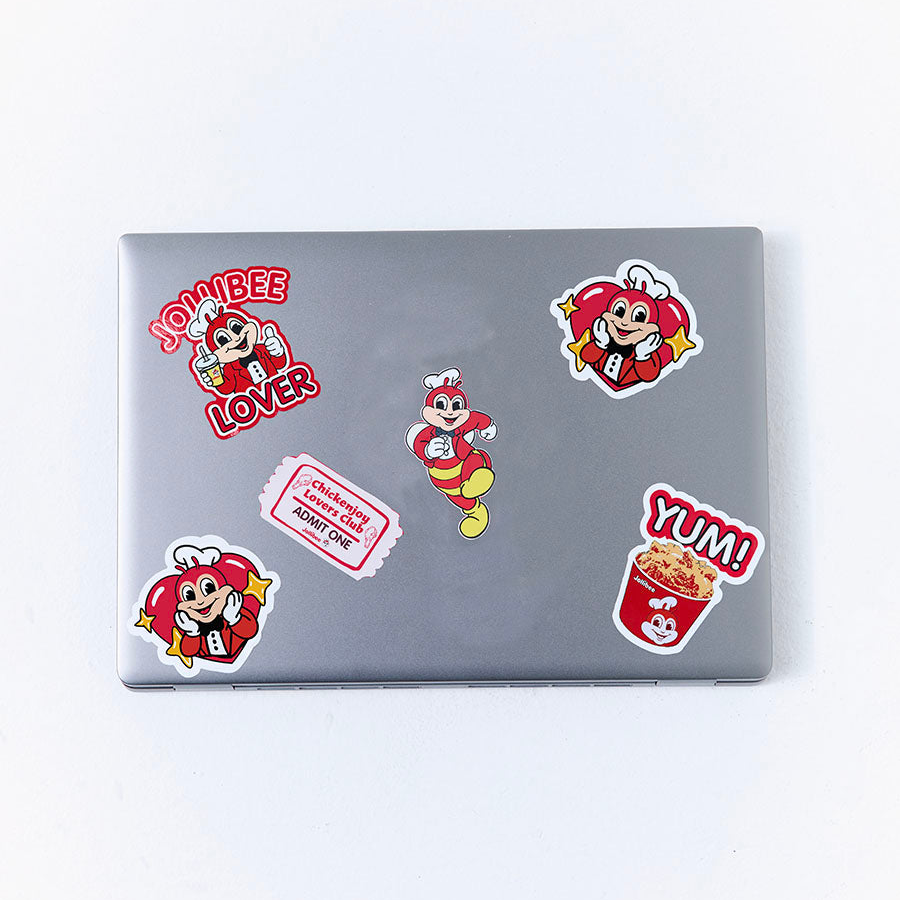 Laptop with Jollibee stickers on a white background
