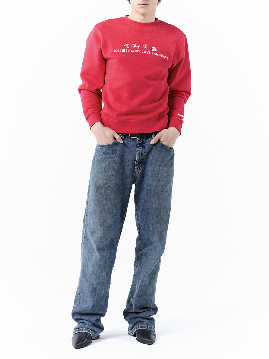 Person wearing a red sweatshirt and blue jeans on a white background