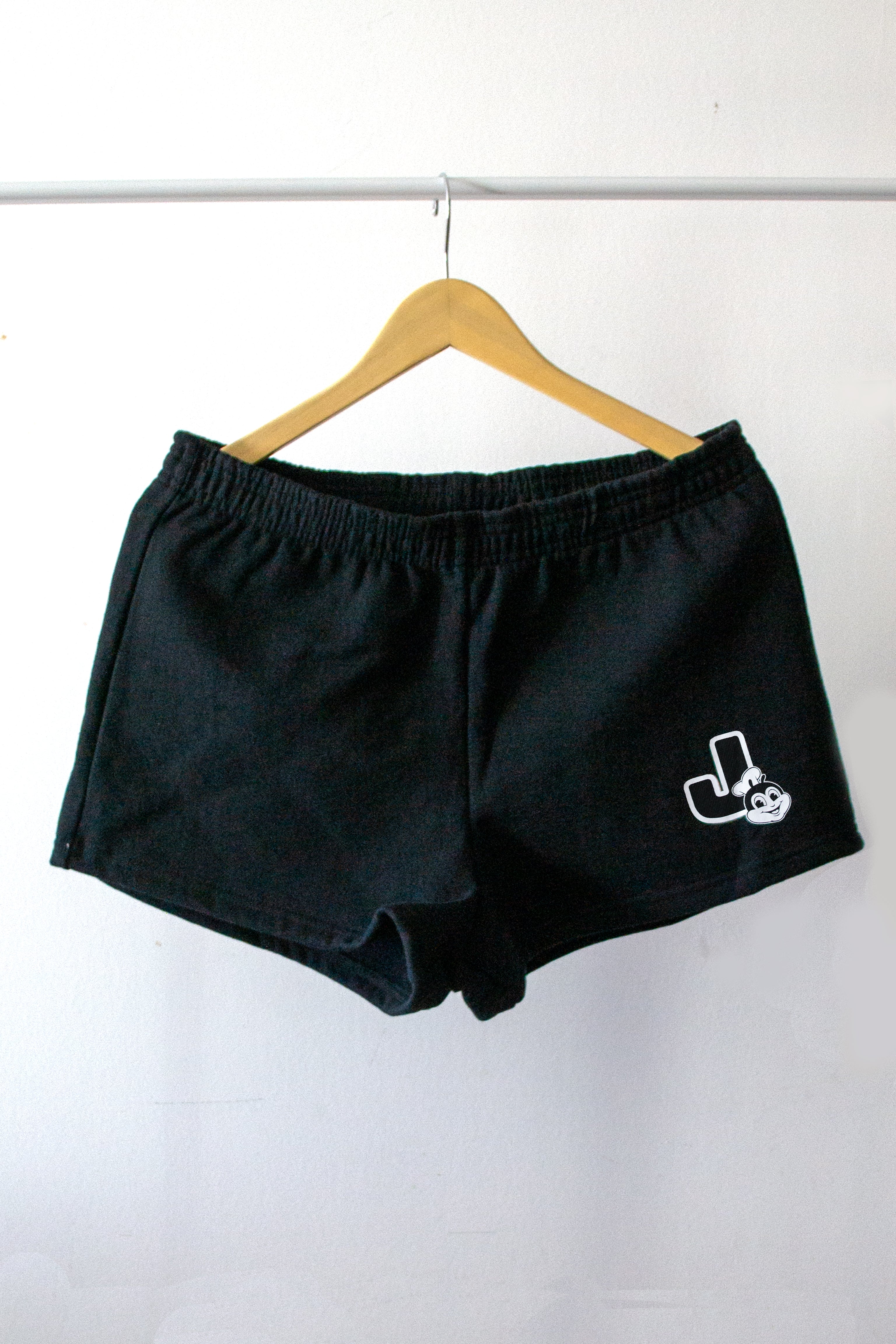 Jollibee merch all black coord set shorts on a hanger