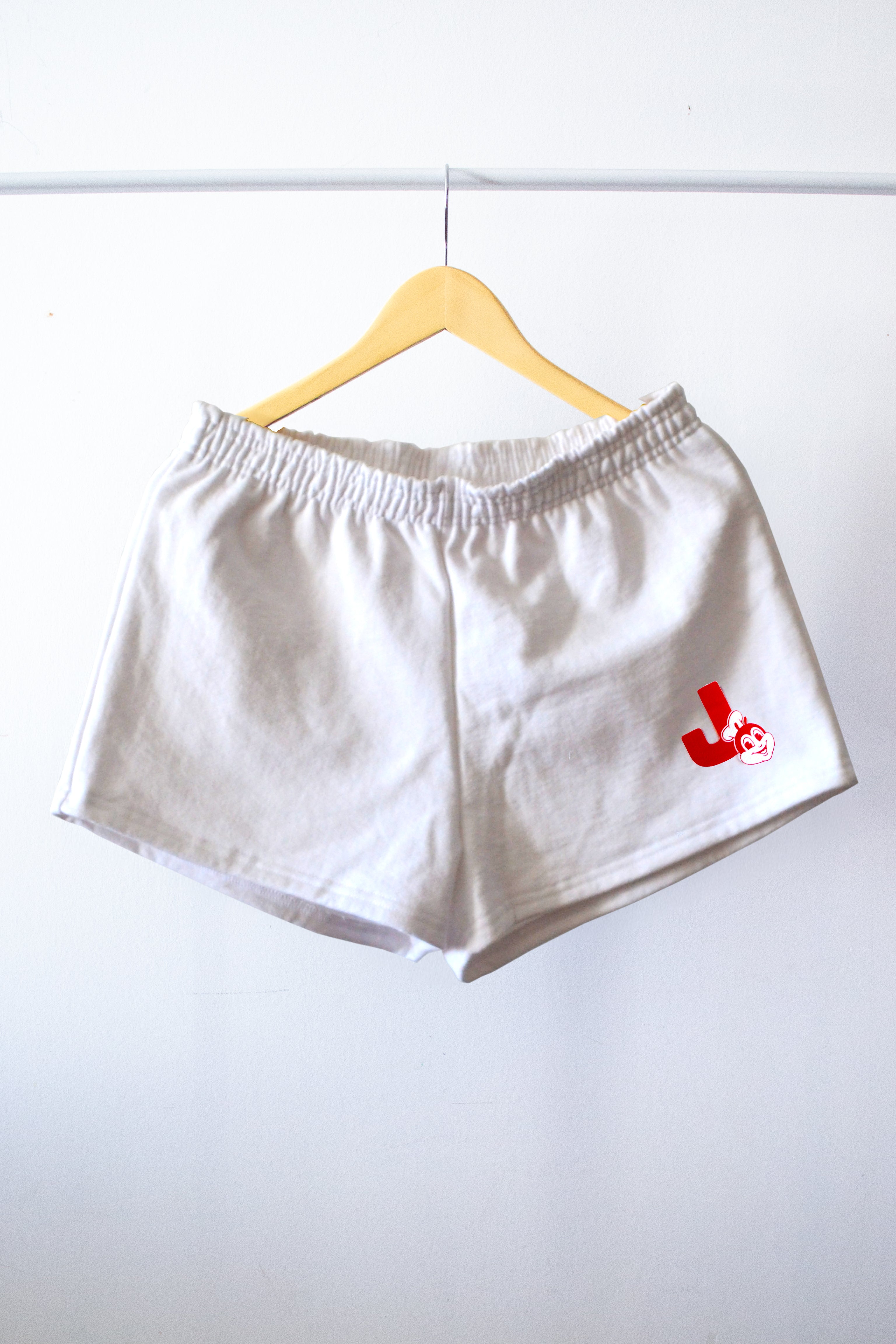 Jollibee white shorts on a hanger
